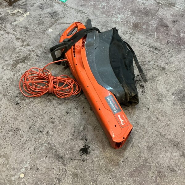 Side view of a Flymo garden vacuum for outdoor cleaning.
