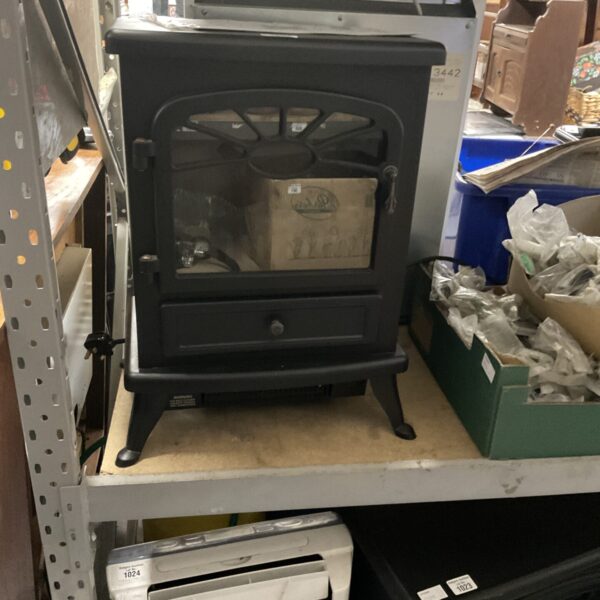 Black vintage Focal Point electric fireplace for home heating and decor.