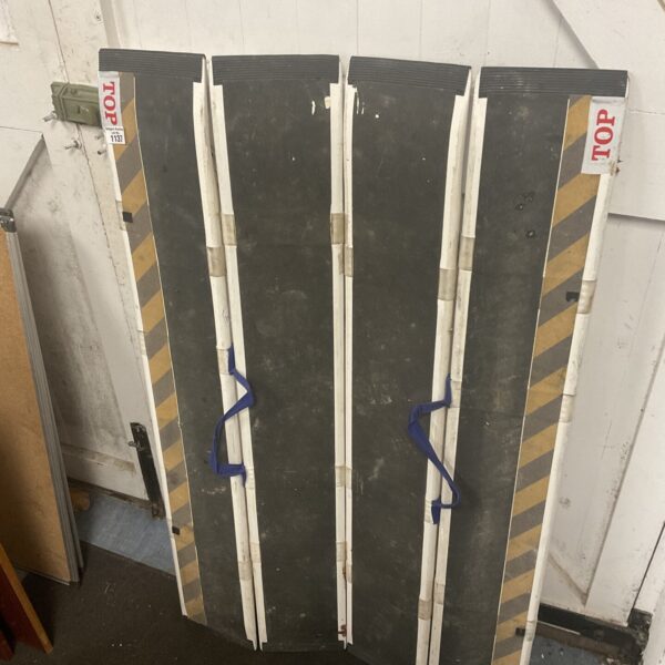 Portable folding access ramp, Decpac caterpillar style, showing signs of use.