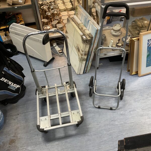 Metal folding trolley for light duty transport and storage.