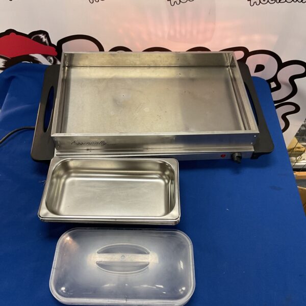 Stainless steel food warmer tray for buffet service.