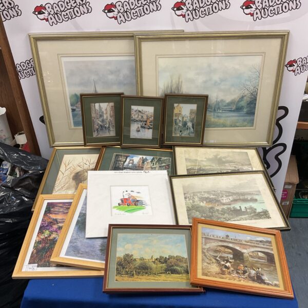 Lot of framed prints including Guernsey engravings and vintage wall art.