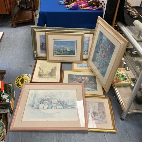 Quantity of framed prints depicting sailing ships and seascapes.