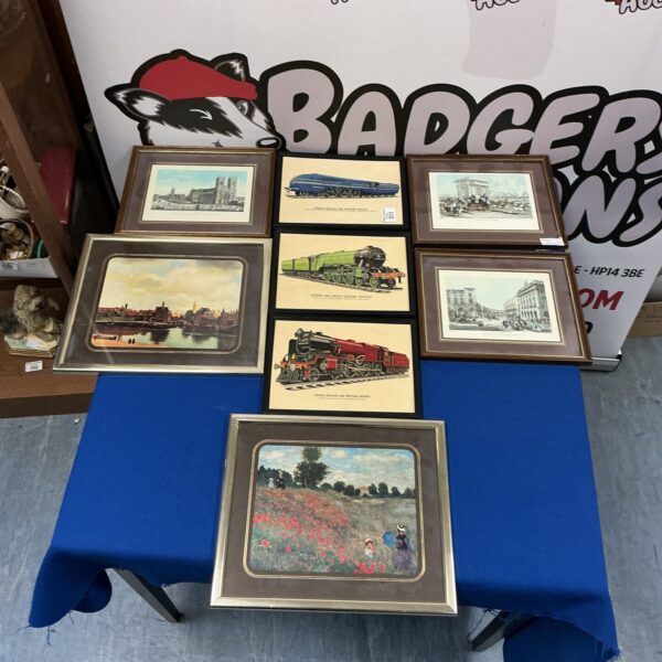 Collection of framed vintage train prints for railway enthusiasts.