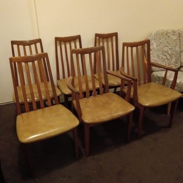 Set of six vintage G-Plan E-Gomme dining chairs with leather seats.