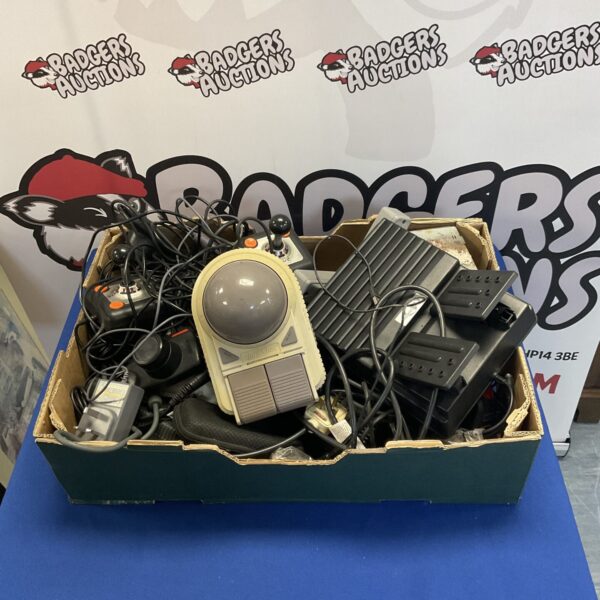 Mixed lot of retro gaming accessories and controllers.