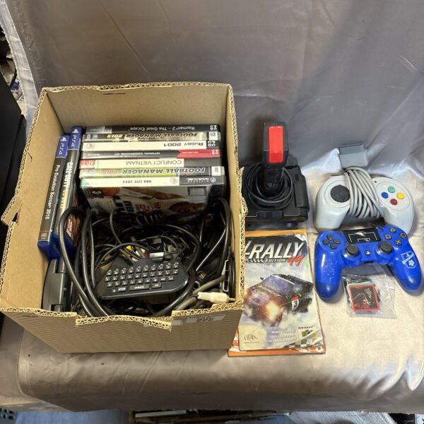 Gaming bundle with PlayStation and PC games, controllers, and power supplies.