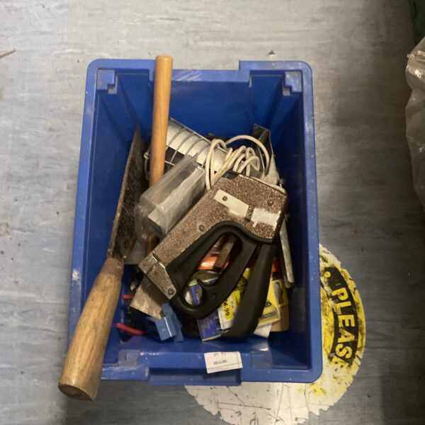 Garage clearance lot with hammer and metal brackets.