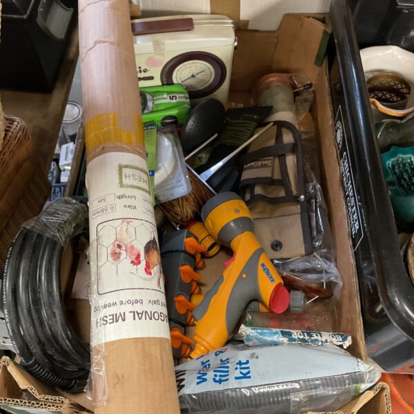 Mixed garden and DIY lot with mesh wire and feeder.