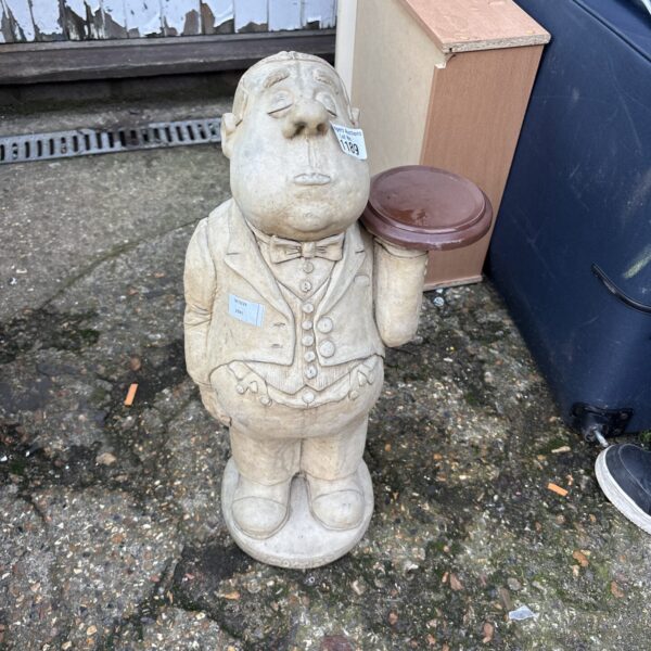 Stone garden butler plant stand for outdoor display.