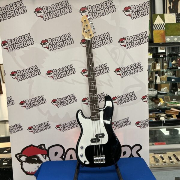 Black Gear4music electric bass guitar, four-string instrument.