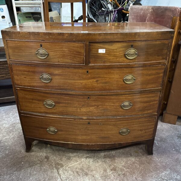 Antique George III mahogany chest of drawers with brass handles.