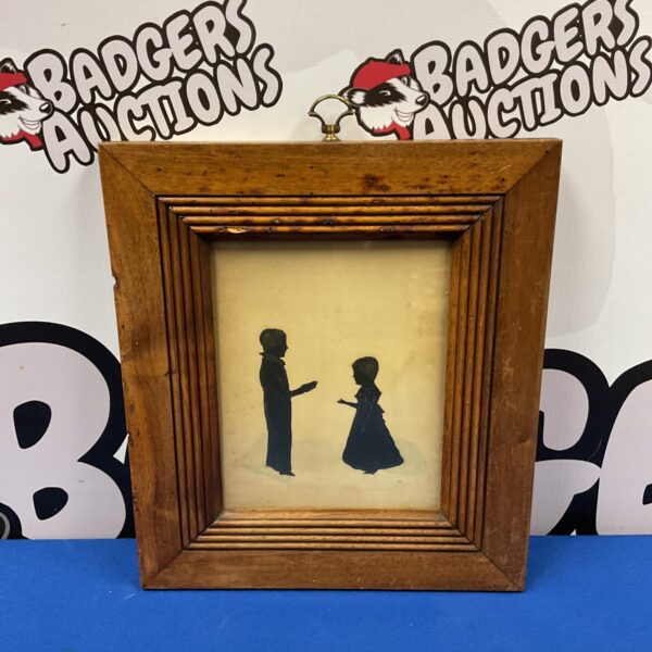 Antique Georgian silhouette portrait of a boy and girl.