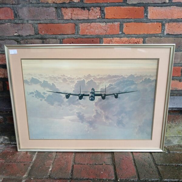 Framed Gerald Coulson print of an outbound RAF Lancaster bomber.