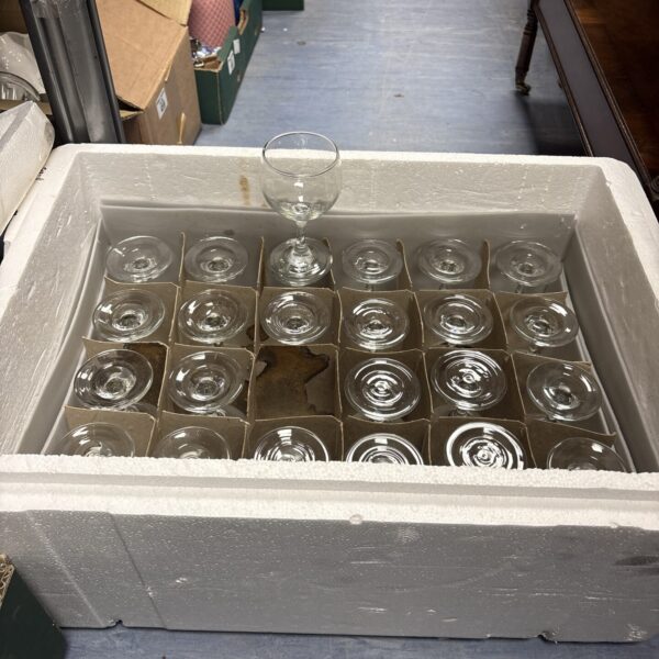 Clear glass goblets arranged in a box, vintage tableware.