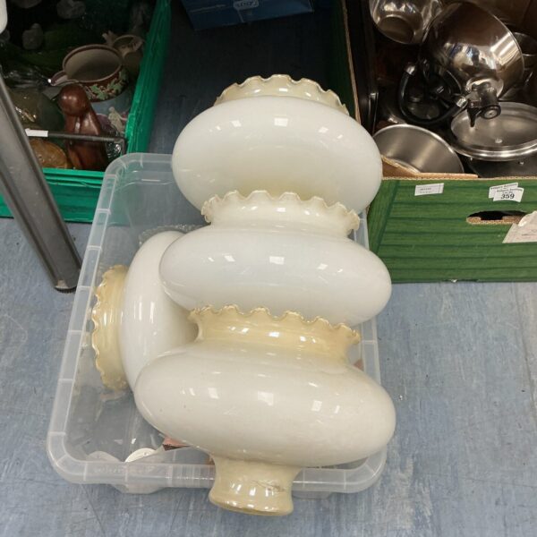 Lot of vintage frosted glass lamp shades for home lighting.