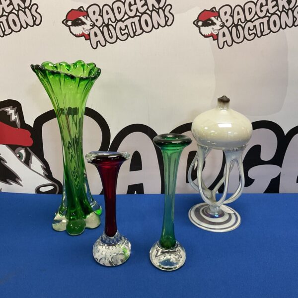 Collection of colourful glass vases for home decor.