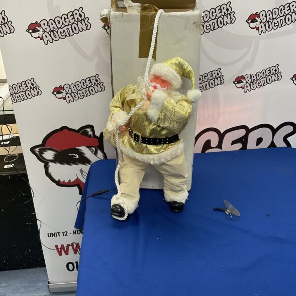 Golden vintage light-up Santa Claus figurine for holiday decor.