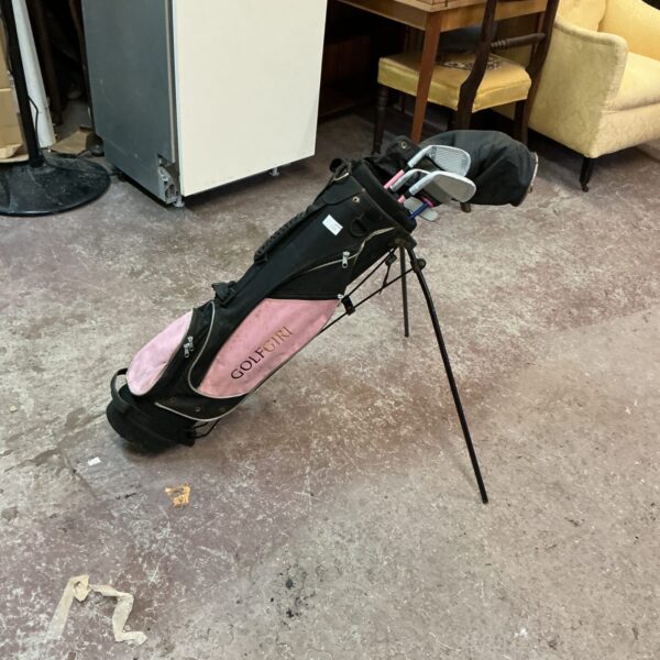 Pink Golf Girl golf bag with stand, showing signs of wear.