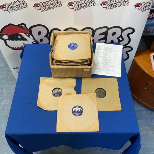 Vintage gramophone records stacked as a lot, offering a glimpse into musical history.