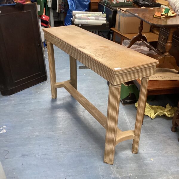 Vintage Grecken console table with curved legs and a rectangular top.