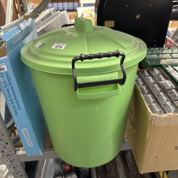 Green plastic bin with hinged lid and carrying handle.