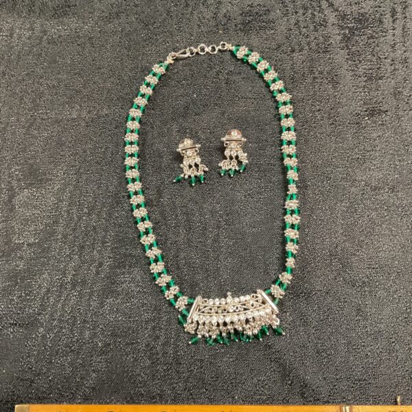 Vintage green stone necklace and earring set, white metal jewellery.