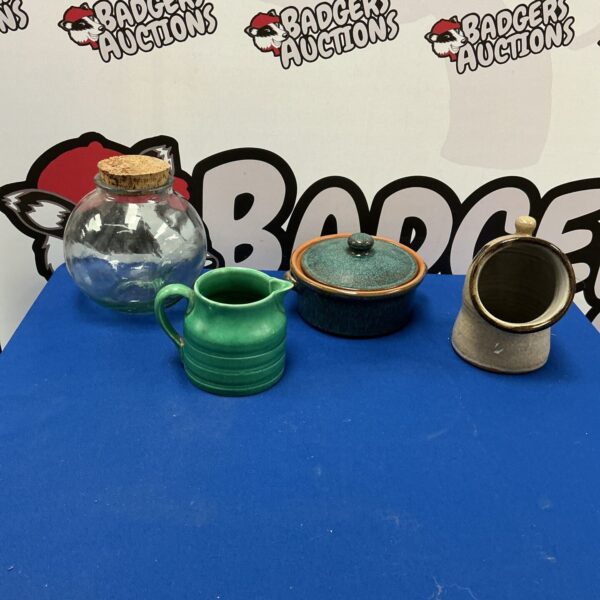 Vintage handmade ceramic jug with a rustic aesthetic.