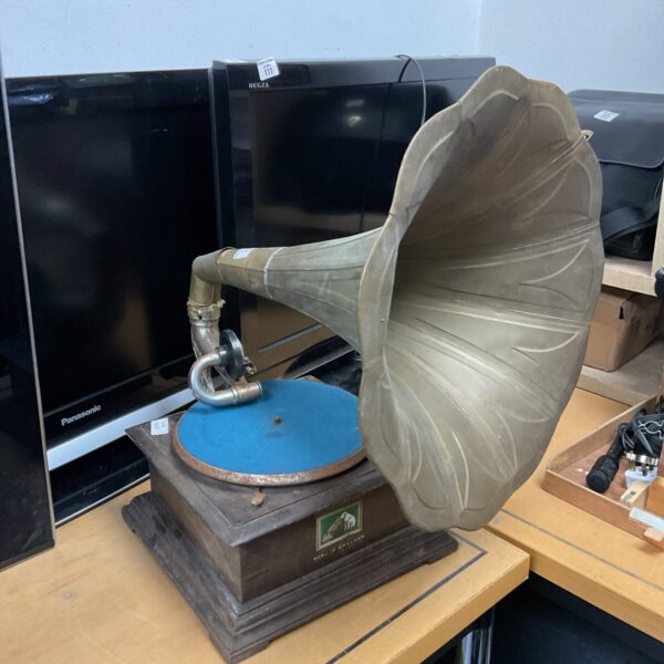 Vintage HMV gramophone with large horn, a classic record player.