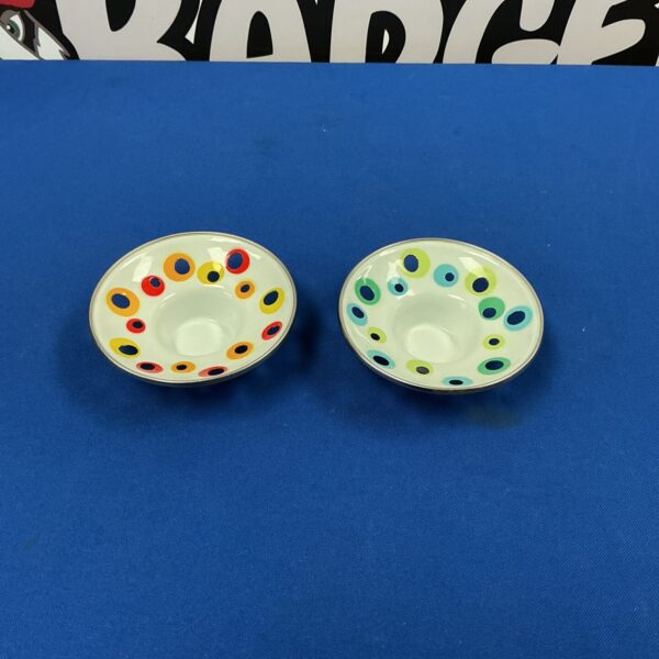 Colourful IKEA tea light holders with a playful dot pattern.