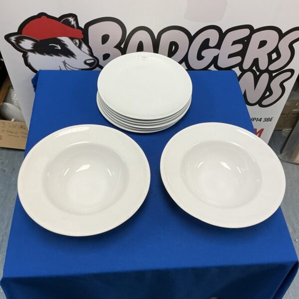 White IKEA dinnerware set including plates and pasta bowls.