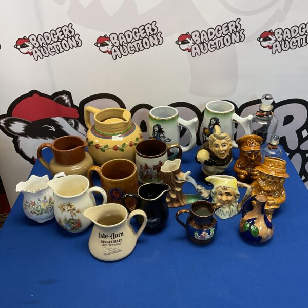 Collection of jugs and tankers, including Isle of Jura scotch whiskey jug and Lords cologne glass bottle