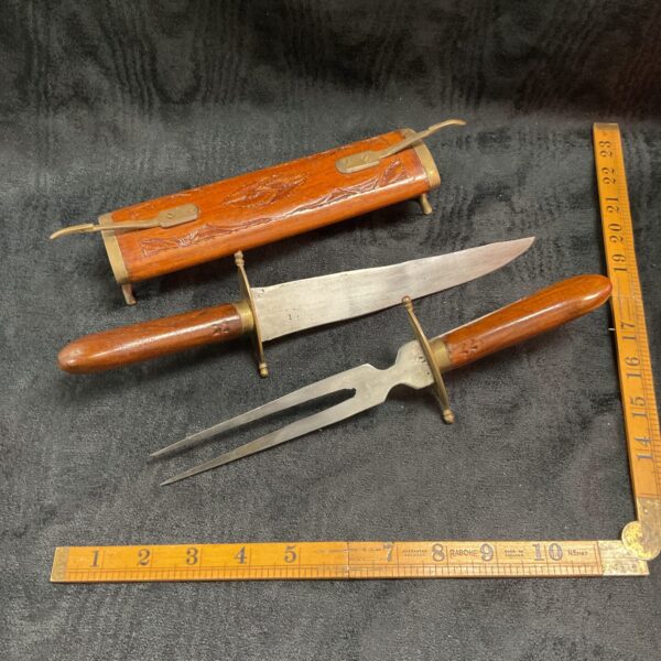 Vintage Indian carved wood carving set with ornate handles.