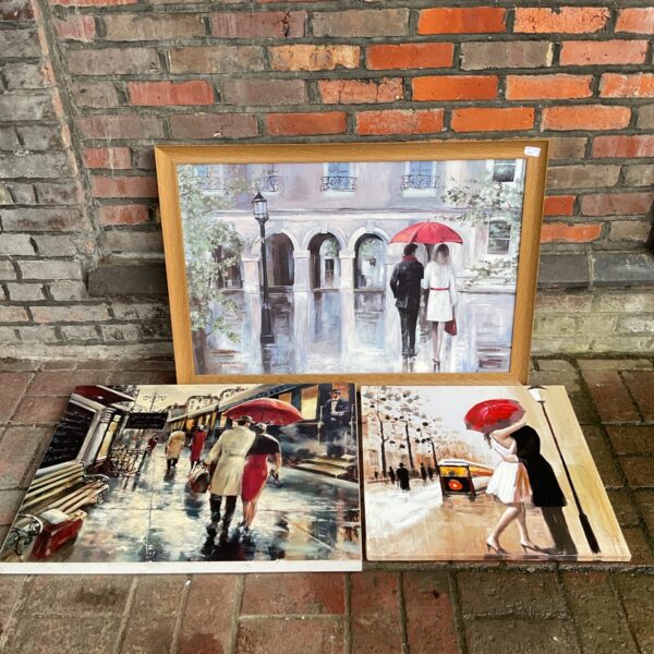 Large framed Jack Vettriano style print depicting a romantic scene.