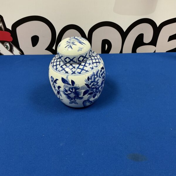 Antique Japanese blue and white ginger jar with floral design.