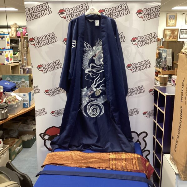Navy blue Japanese kimono robe with golden dragon embroidery.