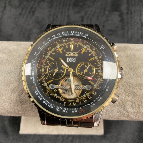 Jaragar automatic wristwatch with a detailed skeleton dial and stainless steel band.