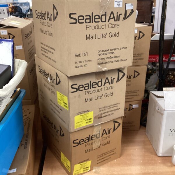 Stack of unopened boxes containing jiffy bags for secure mailing.