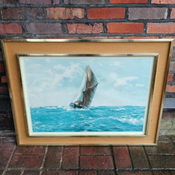 Signed John Chancellor sailing print depicting a boat in rough seas.
