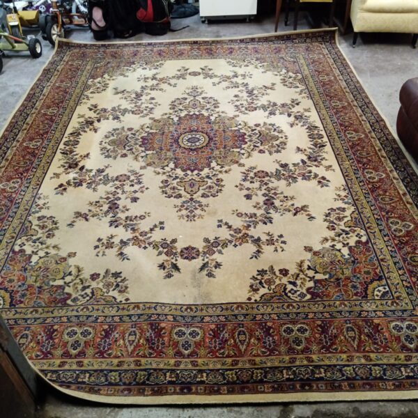 Intricate floral design on a large Kashan Persian rug.