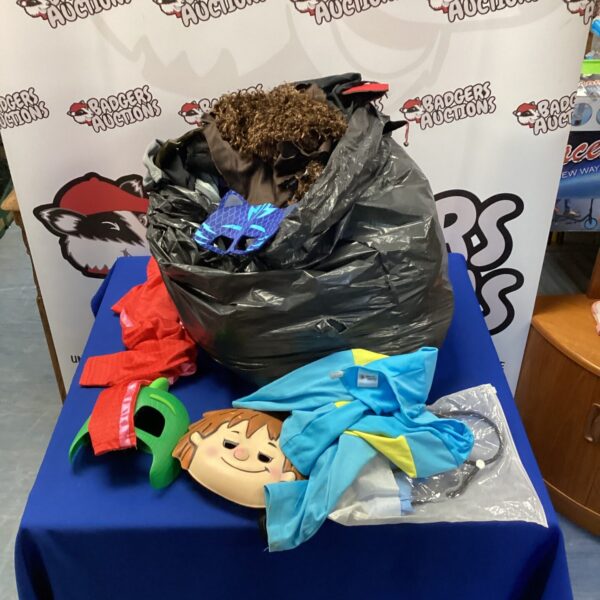 Mixed lot of kids fancy dress costumes including Batman and PJ Masks.