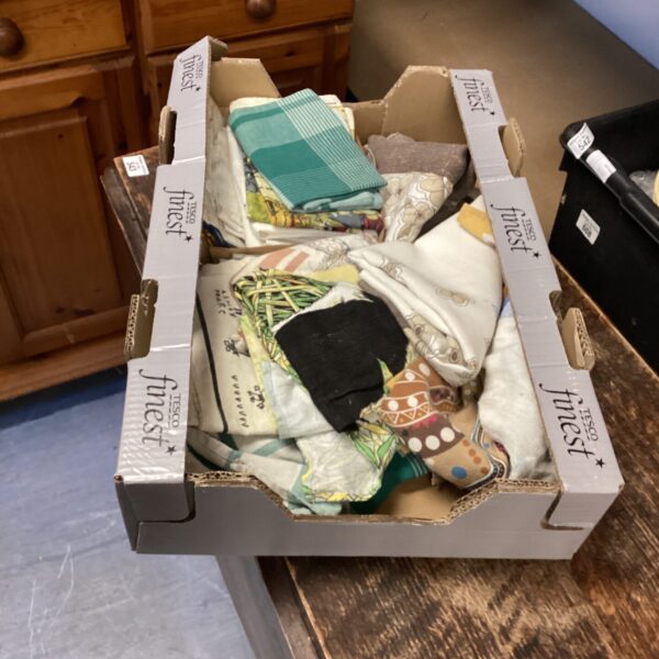 Mixed lot of colourful kitchen towels and linens.