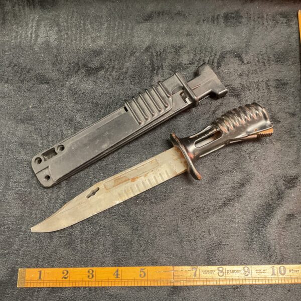 British Army L3A1 bayonet with black scabbard.