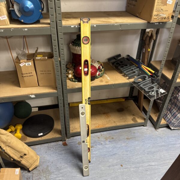 Large B&Q spirit level for accurate DIY measurement and alignment.