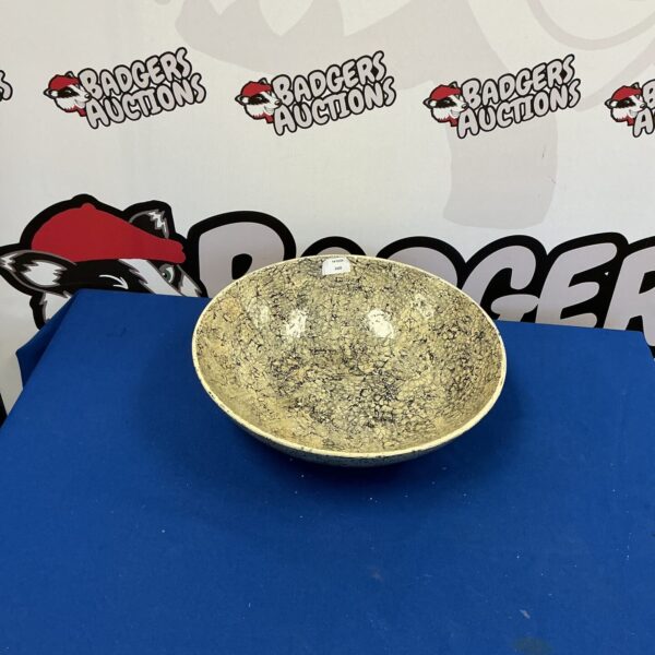 Large ceramic decorative fruit bowl with speckled glaze for kitchen display.