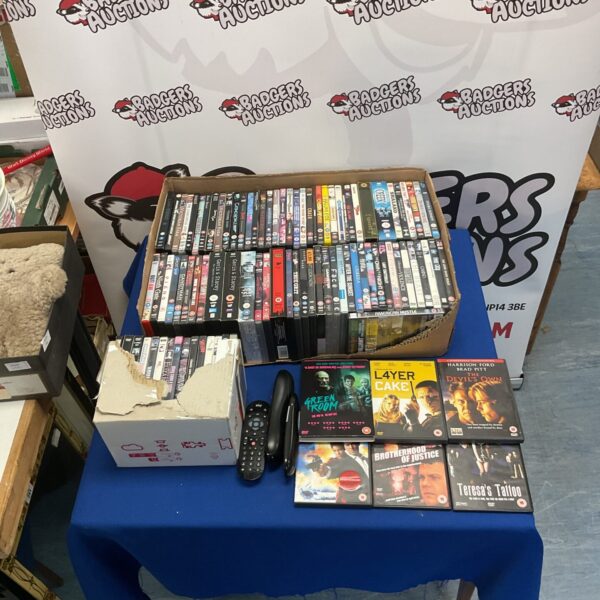 Large collection of DVDs including Clint Eastwood and James Bond films.