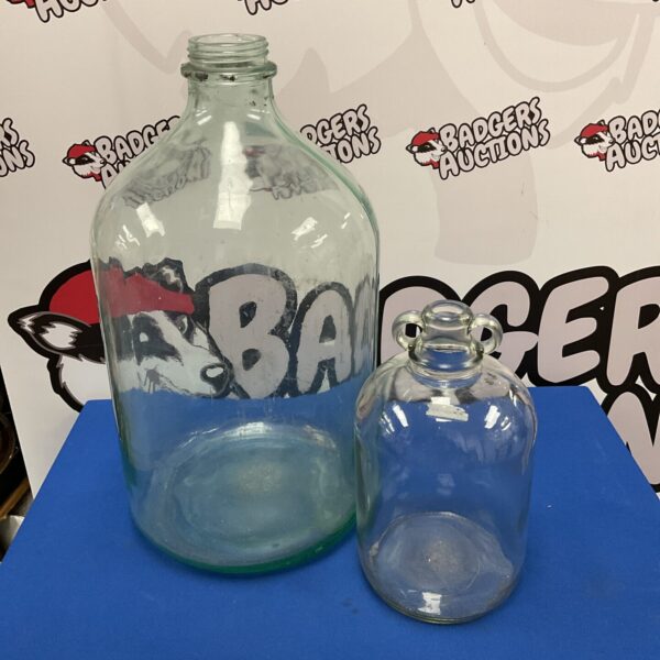 Large glass demijohn vintage bottle for display or repurposing.