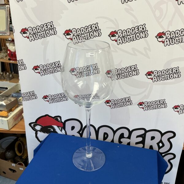 Large handmade wine glass, approximately 30 inches tall, displayed on a dark surface.