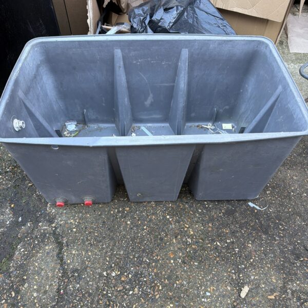 Large plastic water tub for farm use and storage.