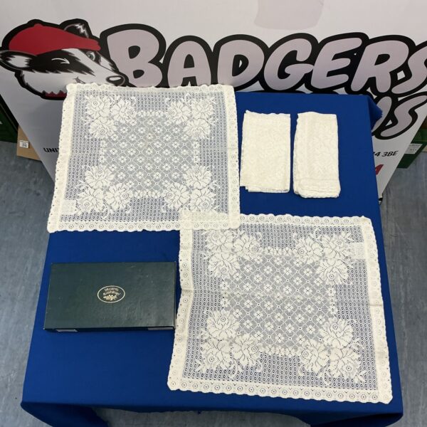 Delicate floral embroidered Laura Ashley placemats for dining table.